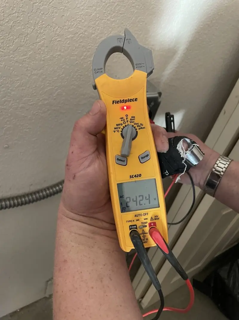 Voltage testing with clamp meter during Ceiling Fan Installation in Lomita